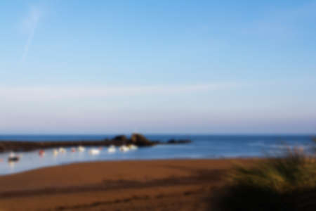 View from the sand dunes on Bude seafront Out of focus.の写真素材