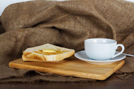 Slices of warm toast against a rustic wooden background