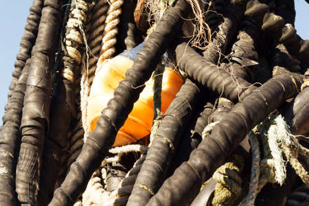 Close up of old fishing ropes coiled upの写真素材