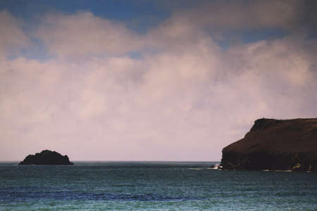 Beautiful view over the sea from Polzeath, Cornwall Vintage Retro Filter.の写真素材