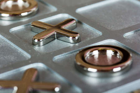 Close up of a metal tic tac toe boardの写真素材