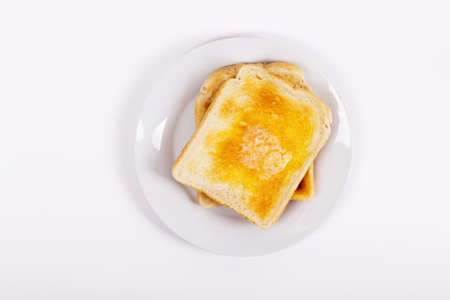 Slice of toast on a white background. Lay Flat.の写真素材