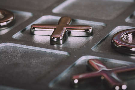 Close up of a metal tic tac toe board Vintage Retro Filter.の写真素材