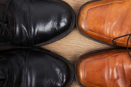 Shoes on a rustic wooden floorの写真素材
