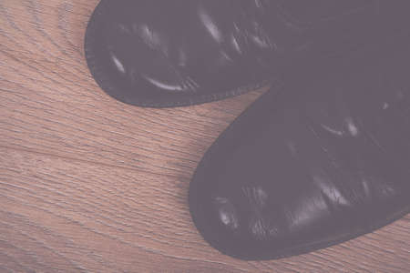 Shoes on a rustic wooden floor Vintage Retro Filter.の写真素材
