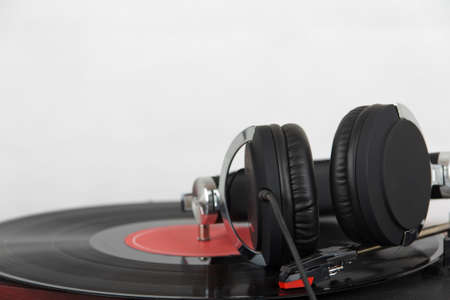 Black headphones on an old retro record player