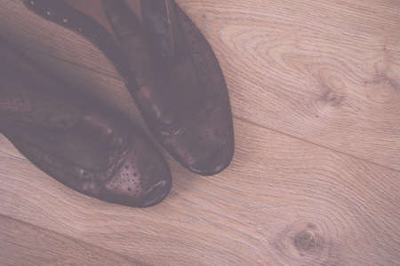 Shoes on a rustic wooden floor Vintage Retro Filter.の写真素材