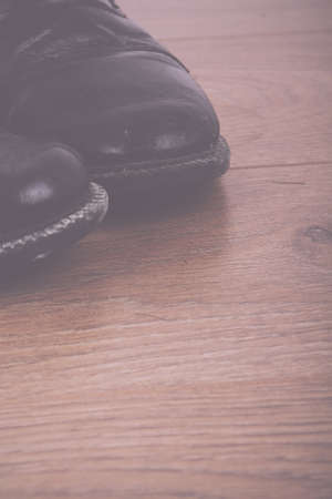 Shoes on a rustic wooden floor Vintage Retro Filter.の写真素材