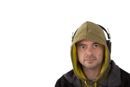 Man in hoodie listening to music on headphonesの写真素材