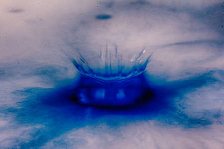 Colorful paint drop splashing on black a background HDR Filter.の写真素材