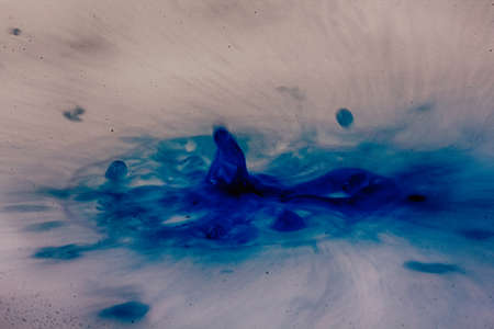 Colorful paint drop splashing on black a background HDR Filter.
