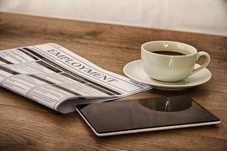 Searching for a new job or employment in a newspaper HDR Filter.の写真素材