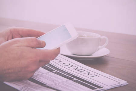 Searching for a new job or employment in a newspaper Vintage Retro Filter.の写真素材