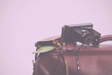 Old vintage brown leather suitcase ready for travelling Vintage Retro Filter.の写真素材