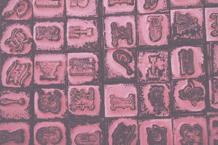 Close up of type set rubber stamps with black ink Vintage Retro Filter.の写真素材