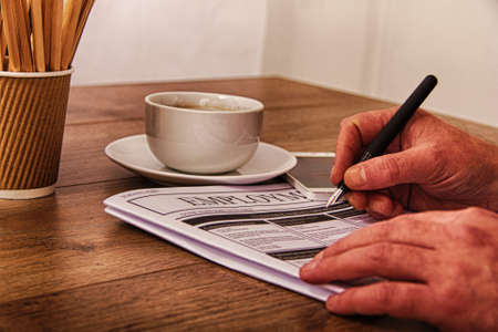 Searching for a new job or employment in a newspaper HDR Filter.の写真素材