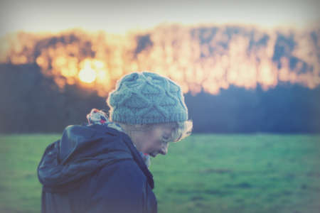 Beautiful mature woman out walking in the countrysideの写真素材