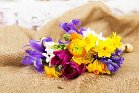 Spring cut flower arrangement against a rustic backgroundの写真素材