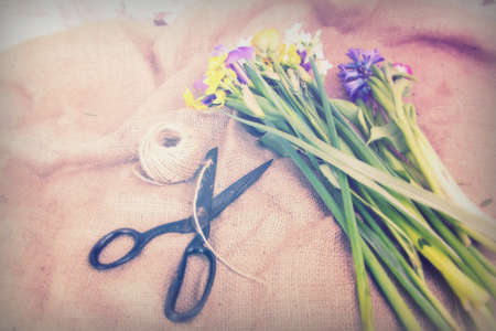 Spring cut flower arrangement against a rustic backgroundの写真素材