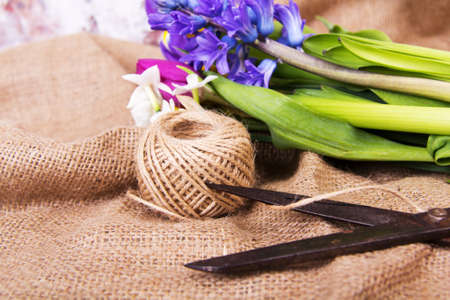 Spring cut flower arrangement against a rustic backgroundの写真素材