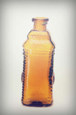 Old colourful vintage bottles against a white backgroundの写真素材