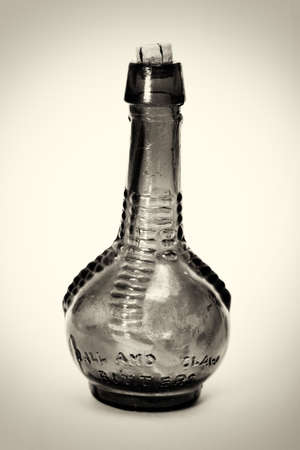 Old colourful vintage bottles against a white backgroundの写真素材