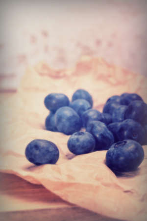 Fresh blueberries on a rustic paper backgroundの写真素材