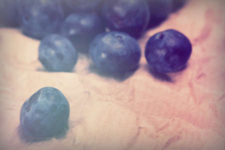 Fresh blueberries on a rustic paper backgroundの写真素材