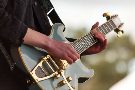 Close up of man playing a rock guitarの写真素材