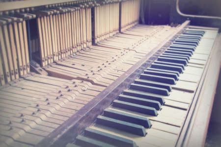 Keys from an old broken and damaged pianoの写真素材