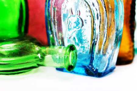 Old colourful vintage bottles against a white backgroundの写真素材