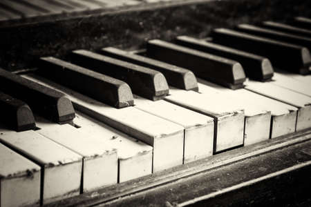 Keys from an old broken and damaged pianoの写真素材