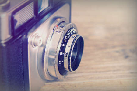 Old vintage retro camera on a wooden backgroundの写真素材