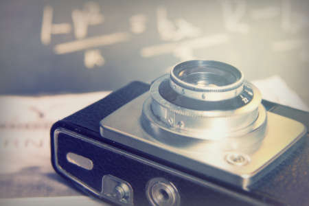 Old vintage retro camera with mocked up daily newspaperの写真素材