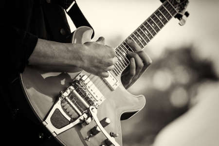 Close up of man playing a rock guitarの写真素材