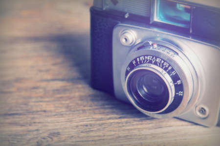 Old vintage retro camera on a wooden backgroundの写真素材
