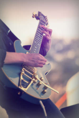 Close up of man playing a rock guitarの写真素材