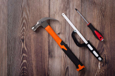 wooden table with home construction toolsの写真素材