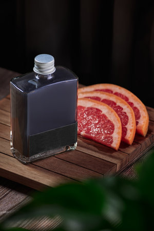 Cocktail jar prepared with grapefruit on a wooden table, no people, jar, clouse upの写真素材