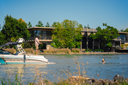 Queretaro, Mexico, 23 11 20, Rescue class in a lake, the instructor is seen approaching the student who is floating on the water of an artificial lake in a boatのeditorial素材