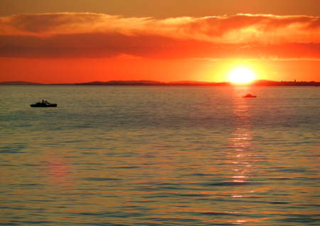 Summer Sunset with 2 pedalos on Lake Constanceの写真素材