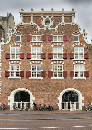House in in a street by a canal in Amsterdam in the Netherlandsのeditorial素材