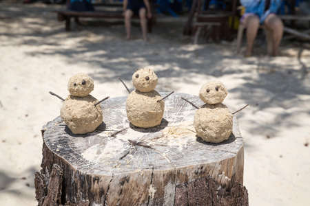 Three sand men on a beach in Kota Kinabalu Malaysiaの写真素材