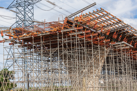 Steel metal scaffolding support structures mounted for concrete mould pouring on road civil...