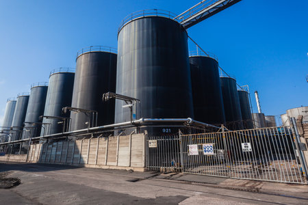 Liquid storage holding tanks for food oils products against blue skyのeditorial素材
