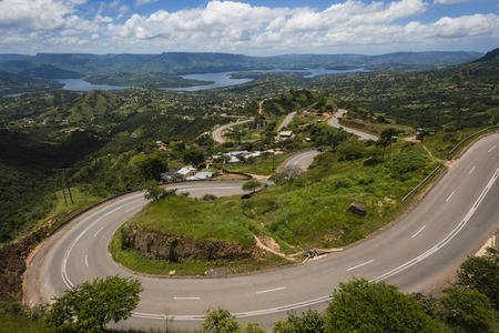 Inanda Dam entry high cliff valley road winds down and up the landscapeの写真素材