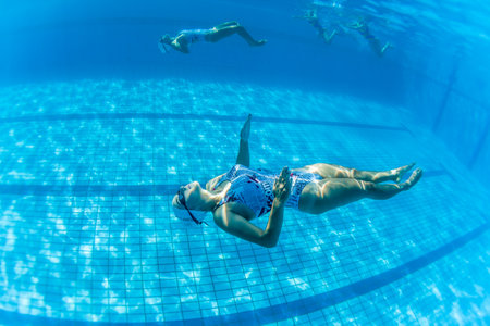 Aquatic Synchronized swimming girls pairs dance underwater surface programs at nationals championshipsのeditorial素材