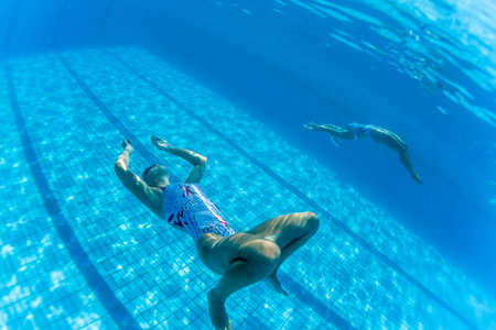 Aquatic Synchronized swimming girls pairs dance underwater surface programs at nationals championshipsのeditorial素材