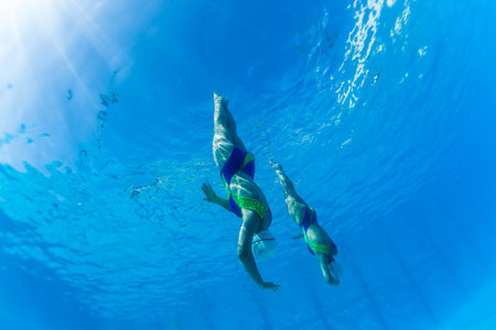 Aquatic Synchronized swimming girls pairs dance underwater surface programs at nationals championshipsのeditorial素材