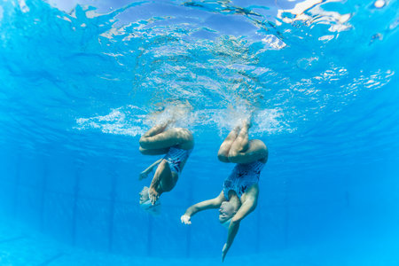 Aquatic Synchronized swimming girls pairs dance underwater surface programs at nationals championshipsのeditorial素材